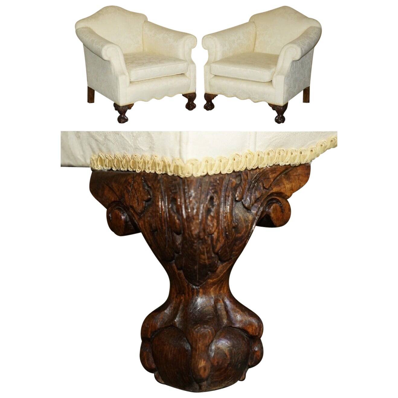 Pair of Edwardian armchairs from 1910 with carved legs and fabric.