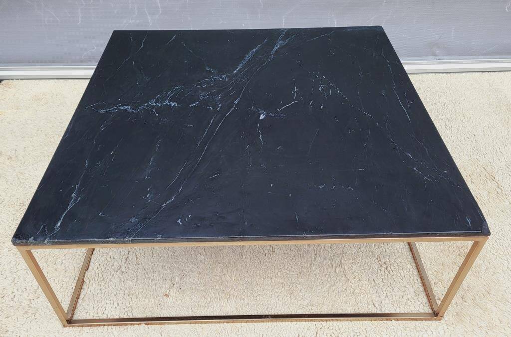 Coffee table or black marble and brass display "in its own juice"