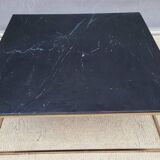 Coffee table or black marble and brass display "in its own juice"