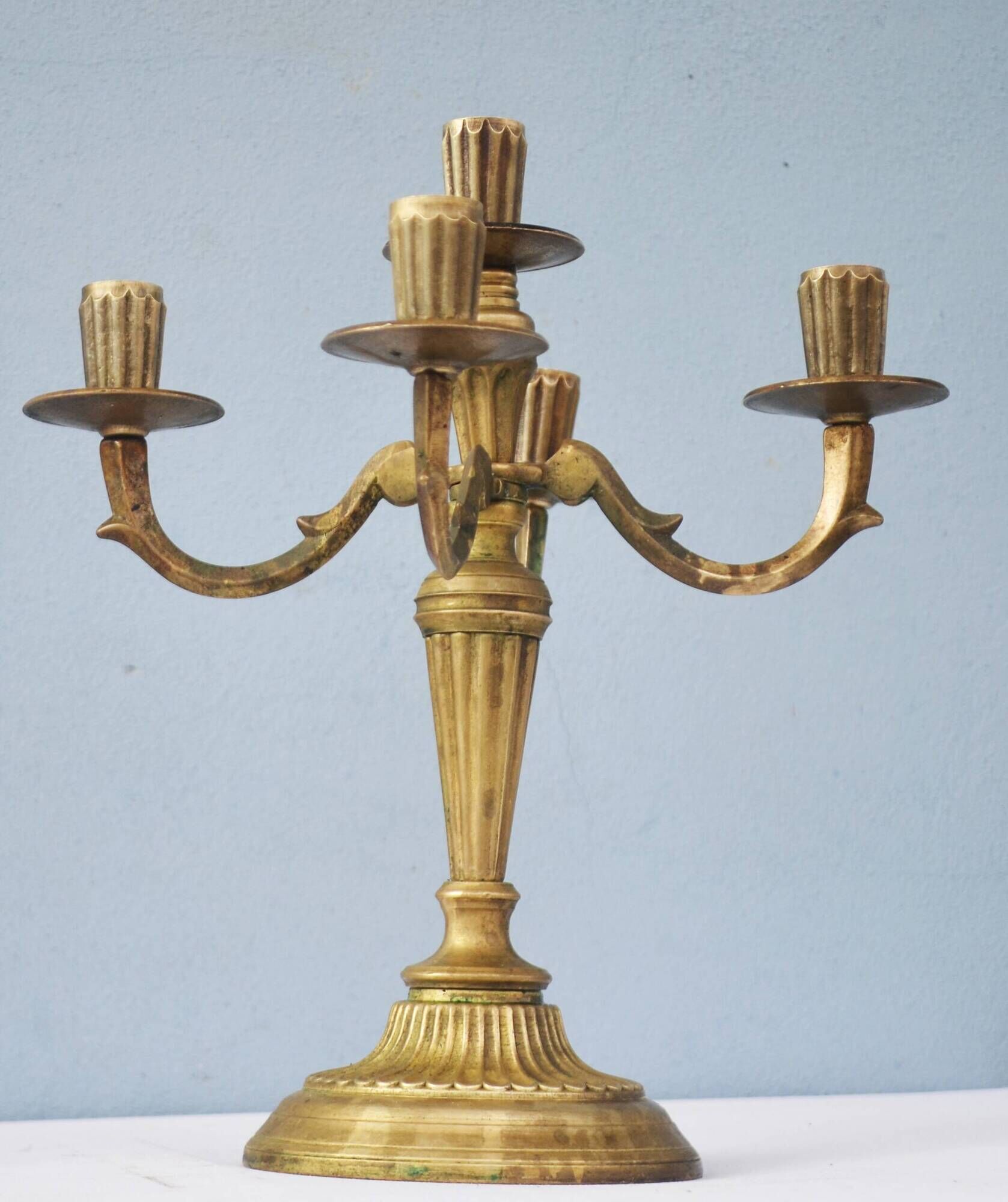 Solid brass candle holder with 5 candles and 4 arms