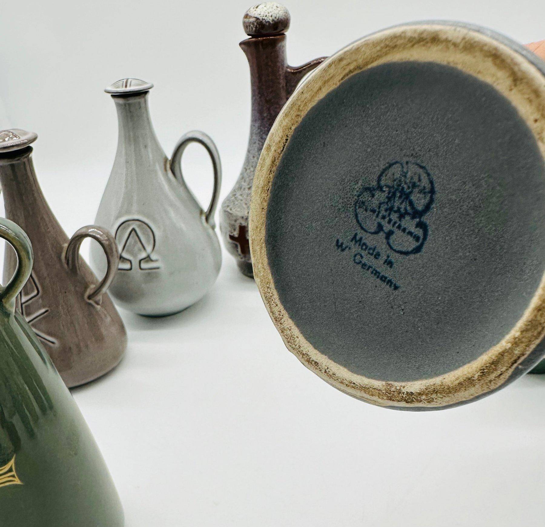 Set of nine modern sculptural ceramic vases from the mid-century, Bauhaus influence.