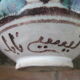 Coloured ceramic vase: arabesques, with Arabic inscription