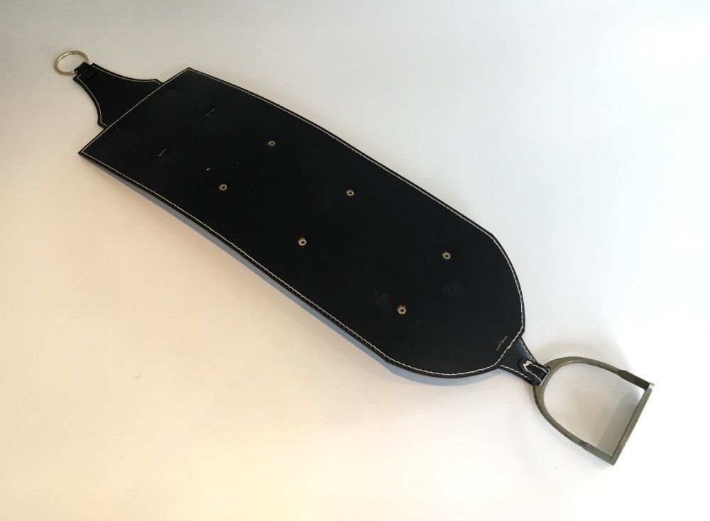 Leather wall-mounted magazine rack. Attributed to Jacques Adnet