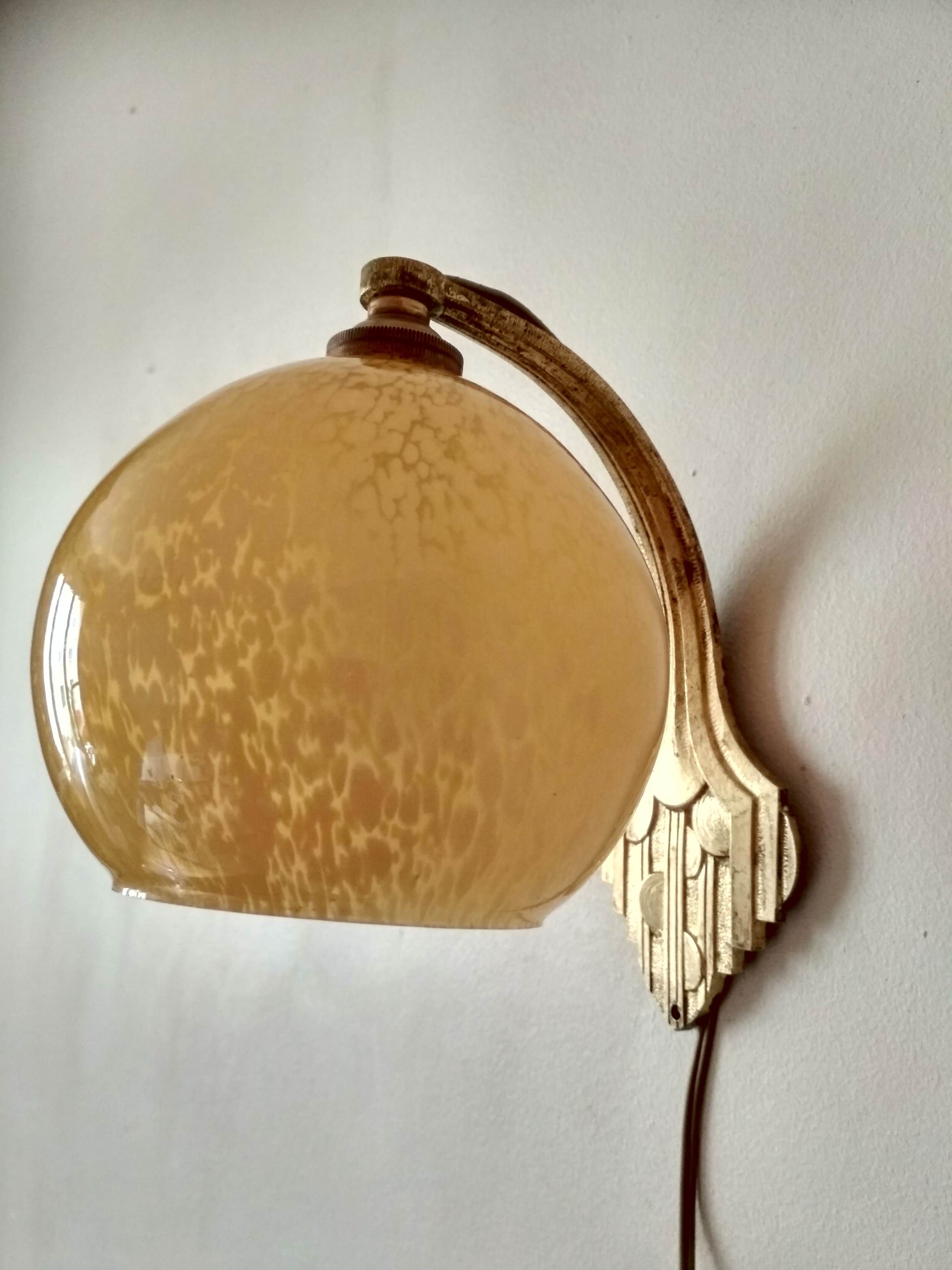 Art deco sconce, golden brass and yellow speckled Clichy glass globe