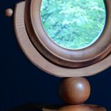 Round mirror psyche of wooden table