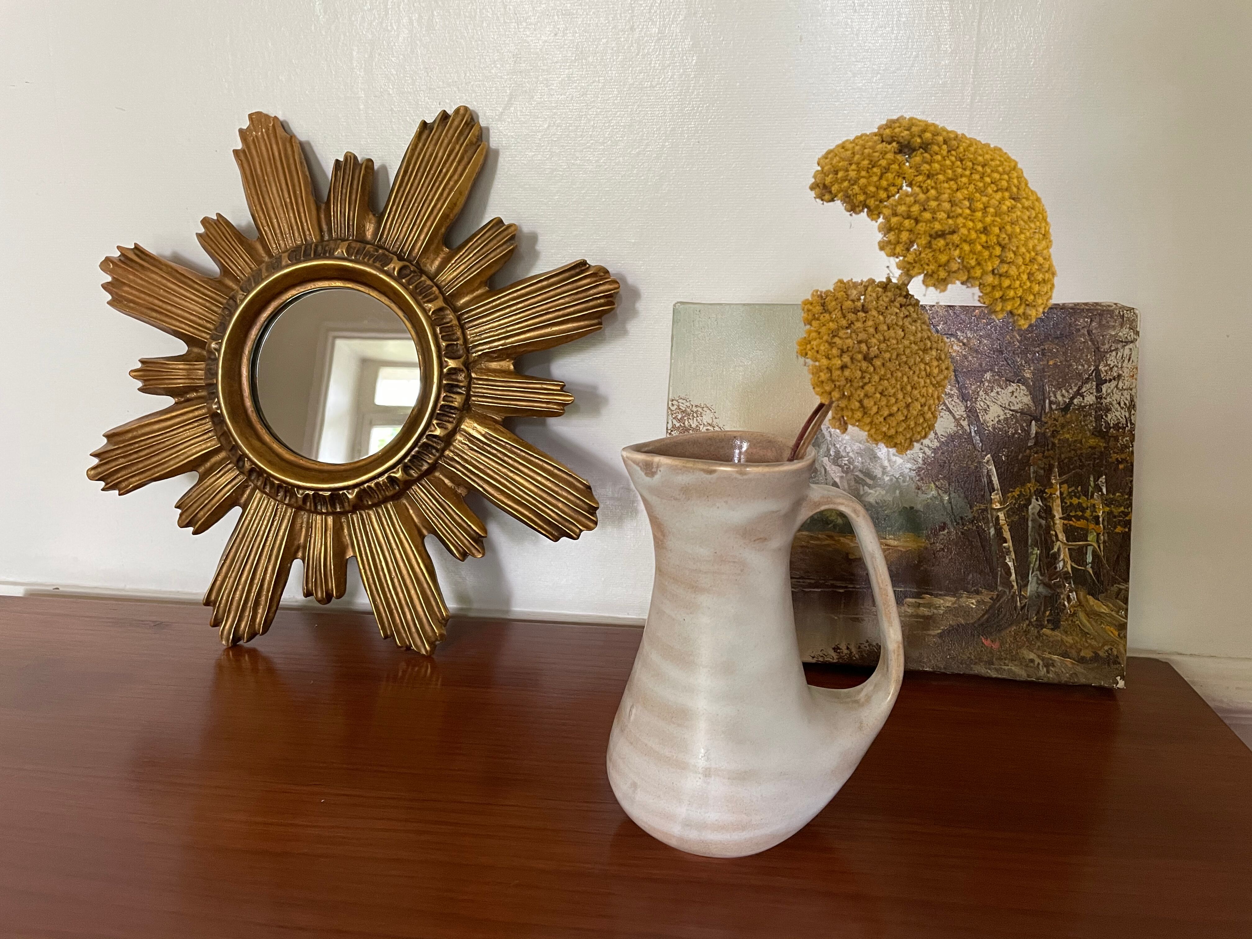 Vintage sun mirror in 60s/70s gold resin