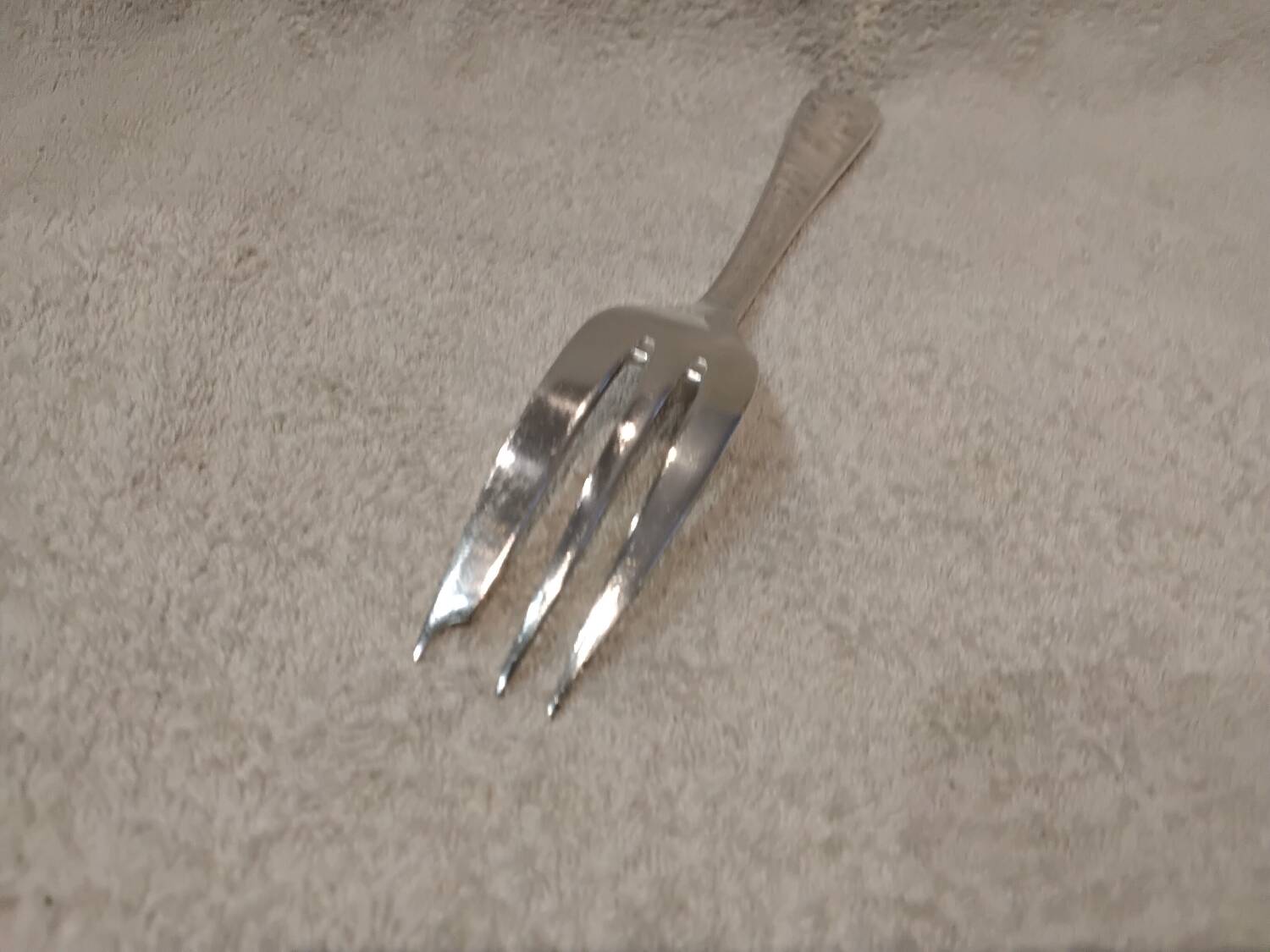 Silver-plated metal stew fork by Christofle silversmiths, Atlas model