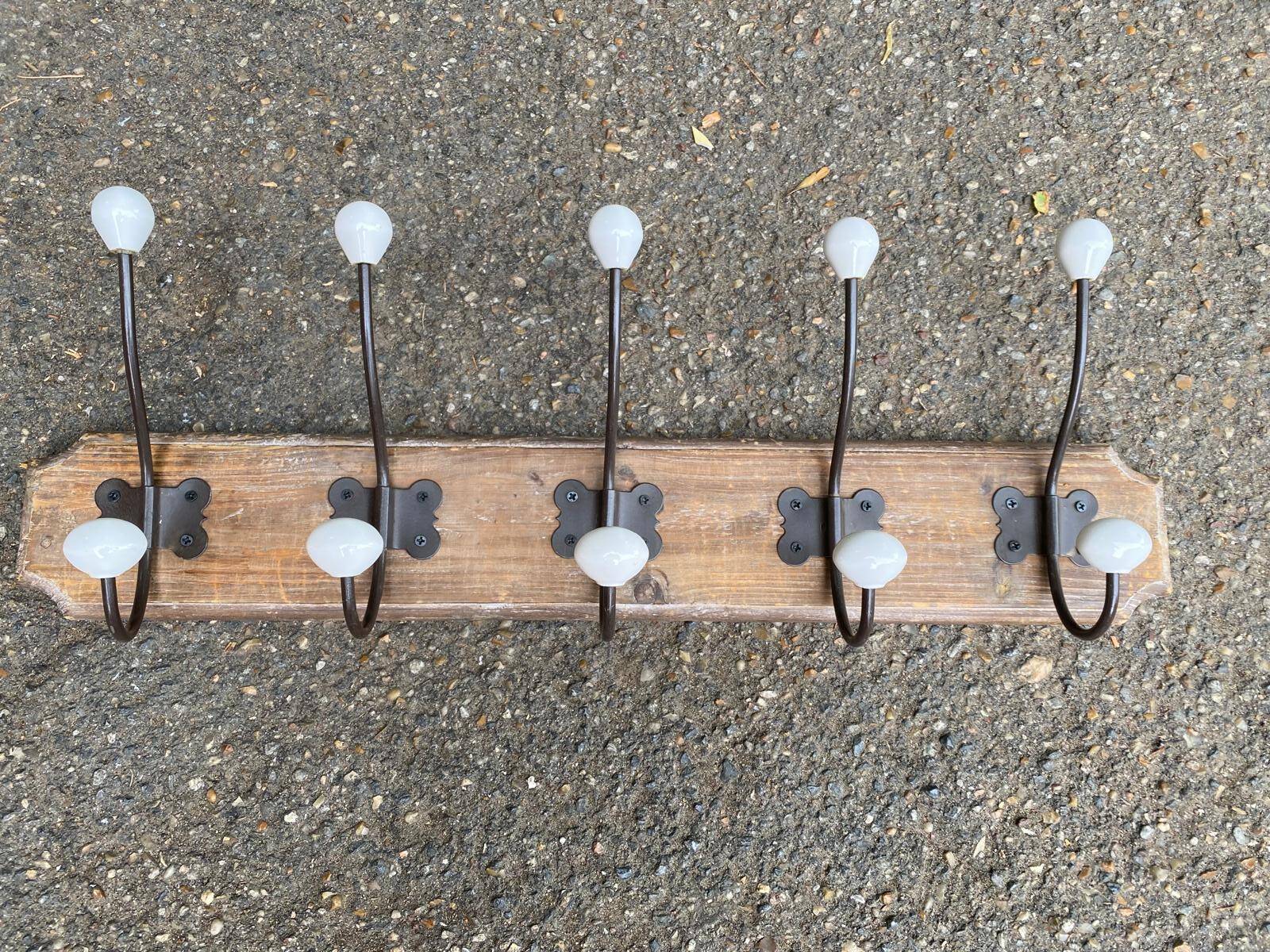 Wall-mounted coat rack with 5 hooks, solid wood, Maisons du Monde.