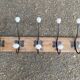 Wall-mounted coat rack with 5 hooks, solid wood, Maisons du Monde.