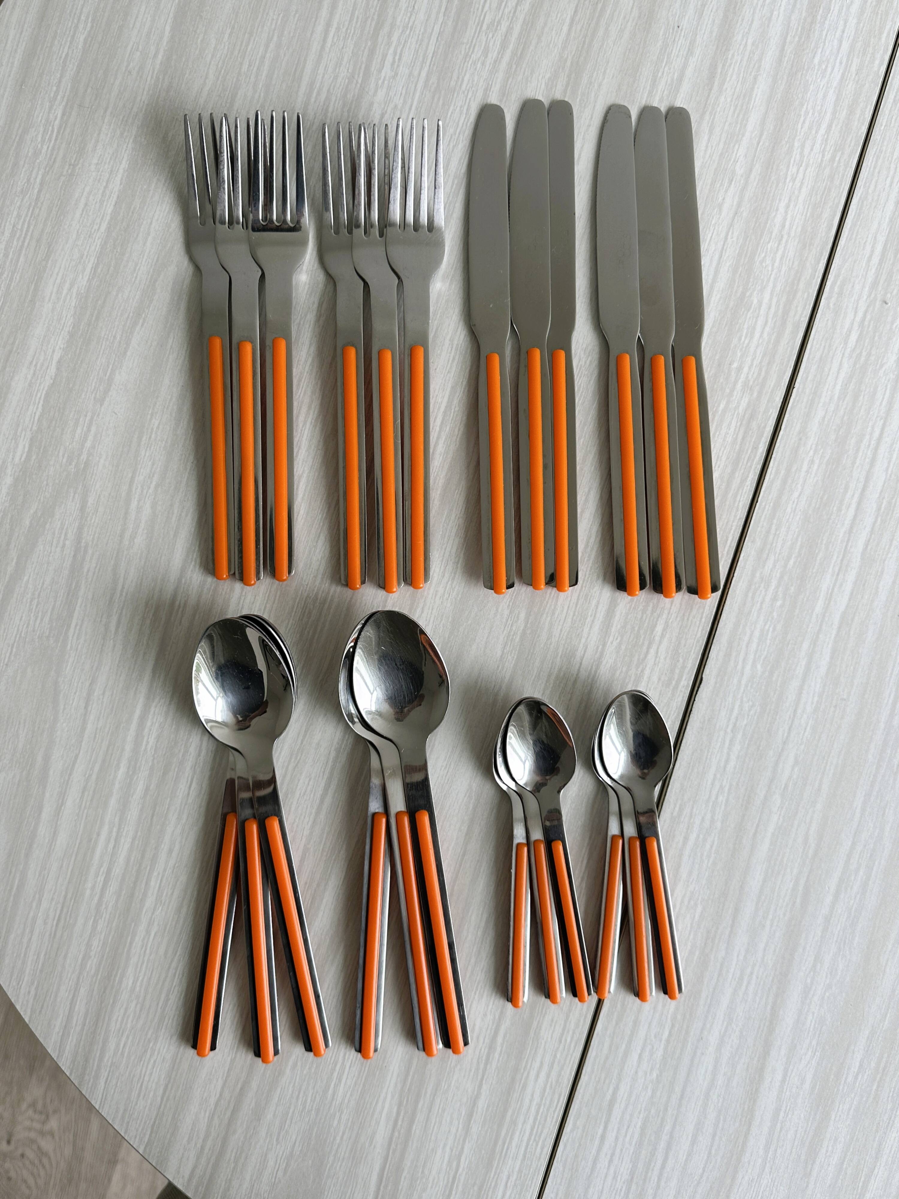 24 vintage stainless steel and orange plastic cutlery sets