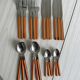 24 vintage stainless steel and orange plastic cutlery sets