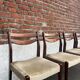 Lot of 4 vintage Scandinavian chairs in wood and golden fabric.