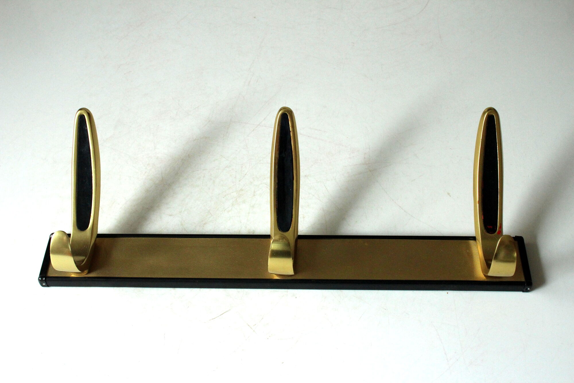 Rockabilly wall mounted metal  and brass coat rack with 3 hooks, vintage from the 1950s