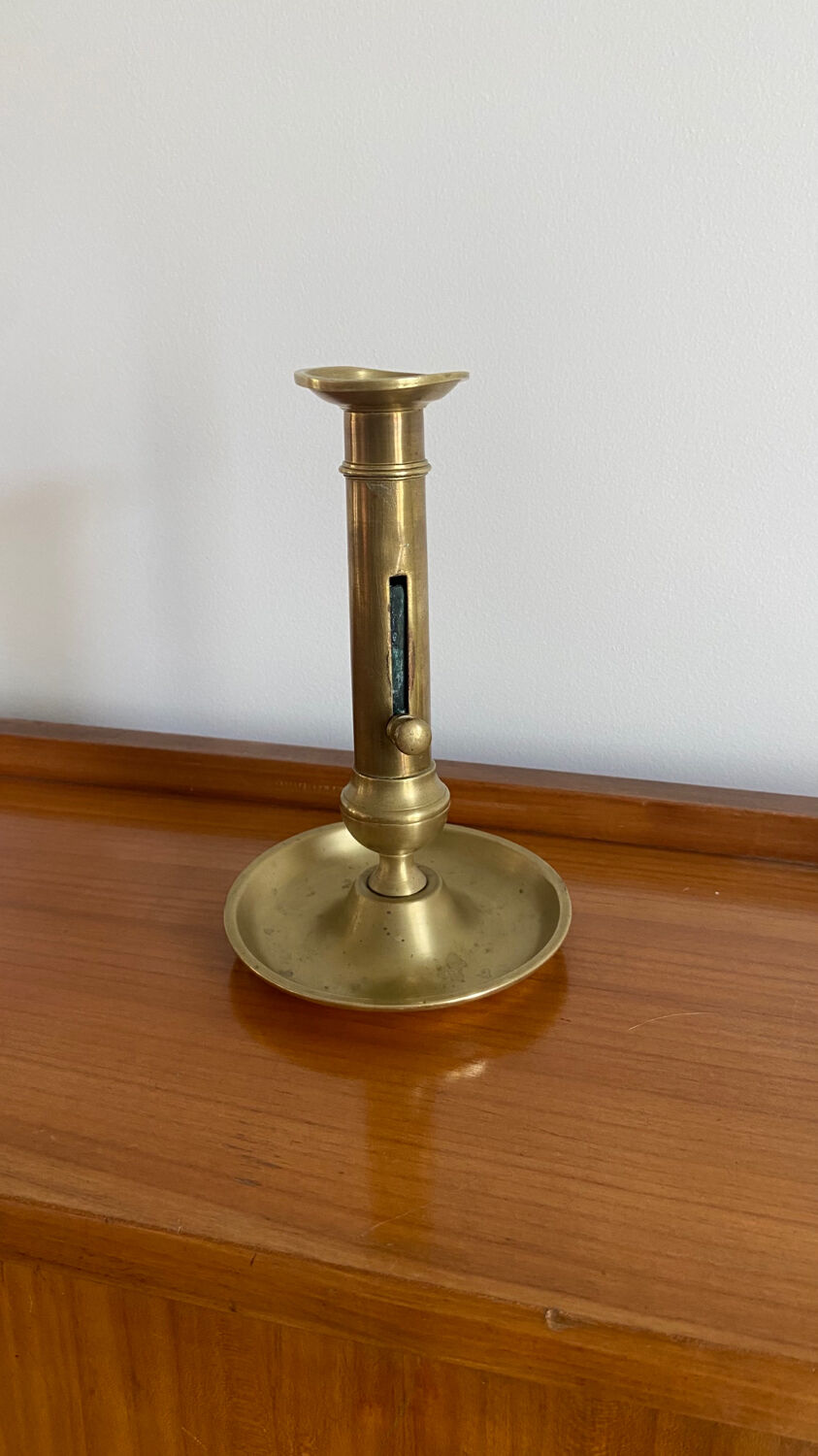 Antique brass push candle holder