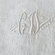 12 antique French linen towels with damask embroidery with "GB" anagrams.