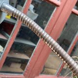 Workshop lamp on ringed metal hose