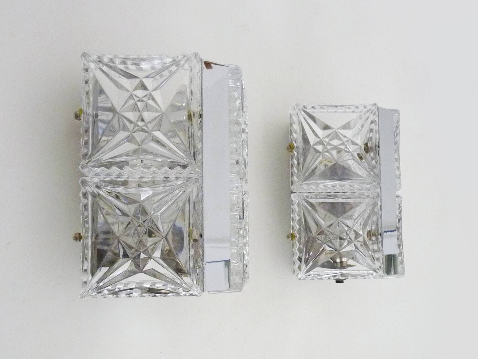 Pair of modernist 1970s glass and chrome metal wall sconces