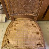 Chair with caned seat and back made of wood