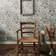 Fauteuil vintage en bois et assise paillée