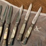 Set of coat of arms fruit cutlery