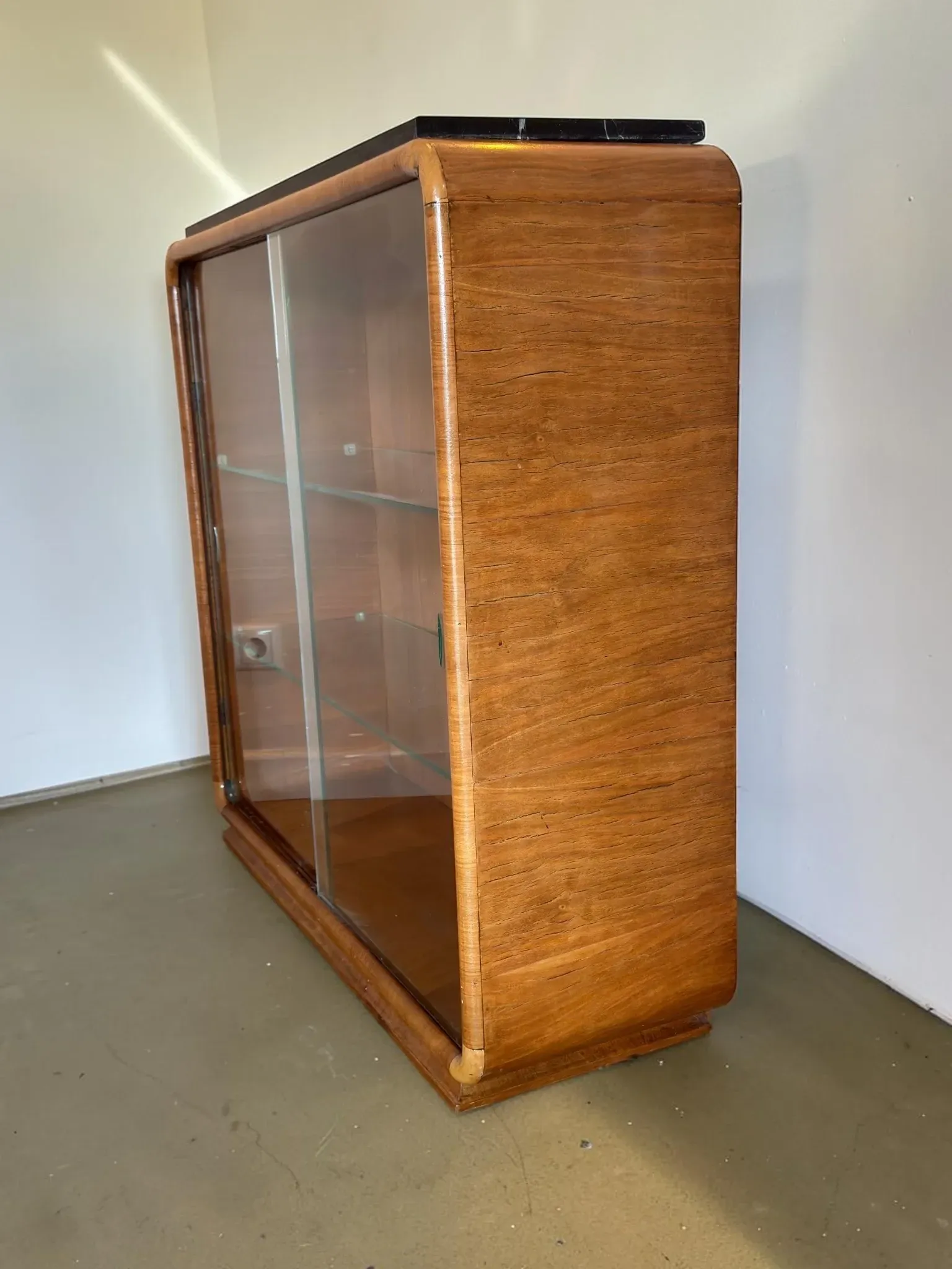 Vintage Art Deco display cabinet in mahogany with a black marble top.