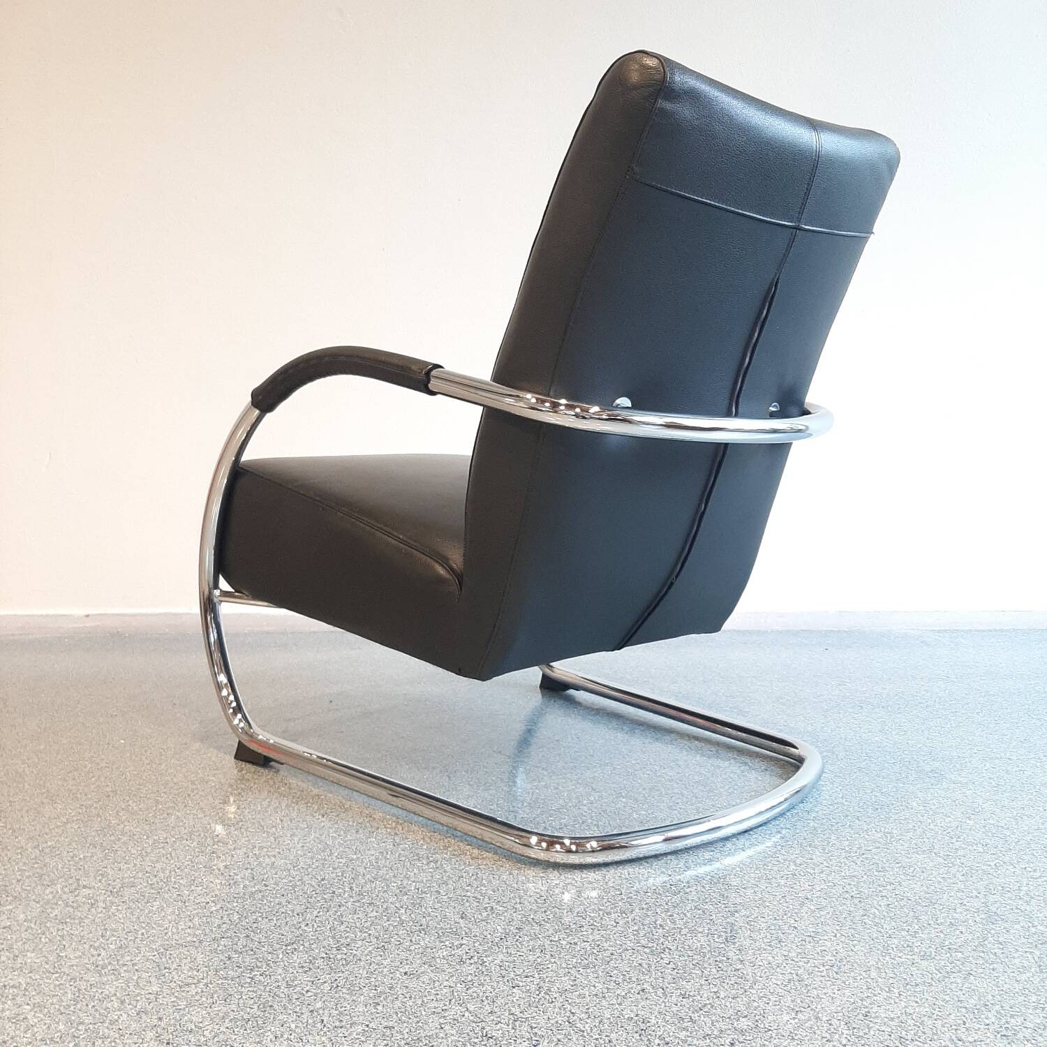 Pair of tubular armchairs