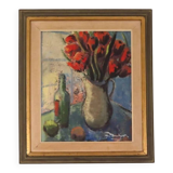 Bouquet rouge et bouteille de vin