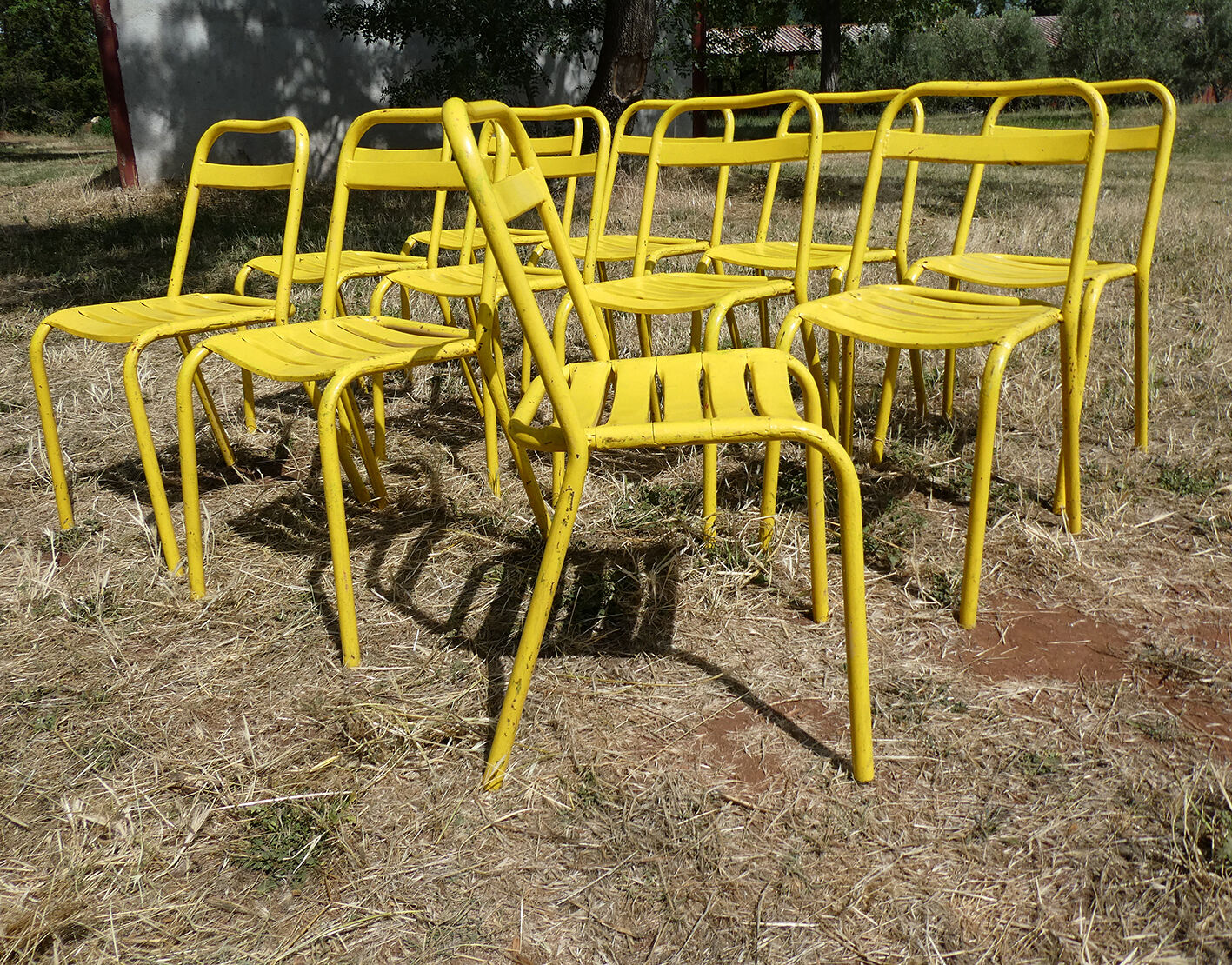 Lot of 11 yellow metallic bistro chairs from the 1950s