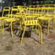 Lot of 11 yellow metallic bistro chairs from the 1950s