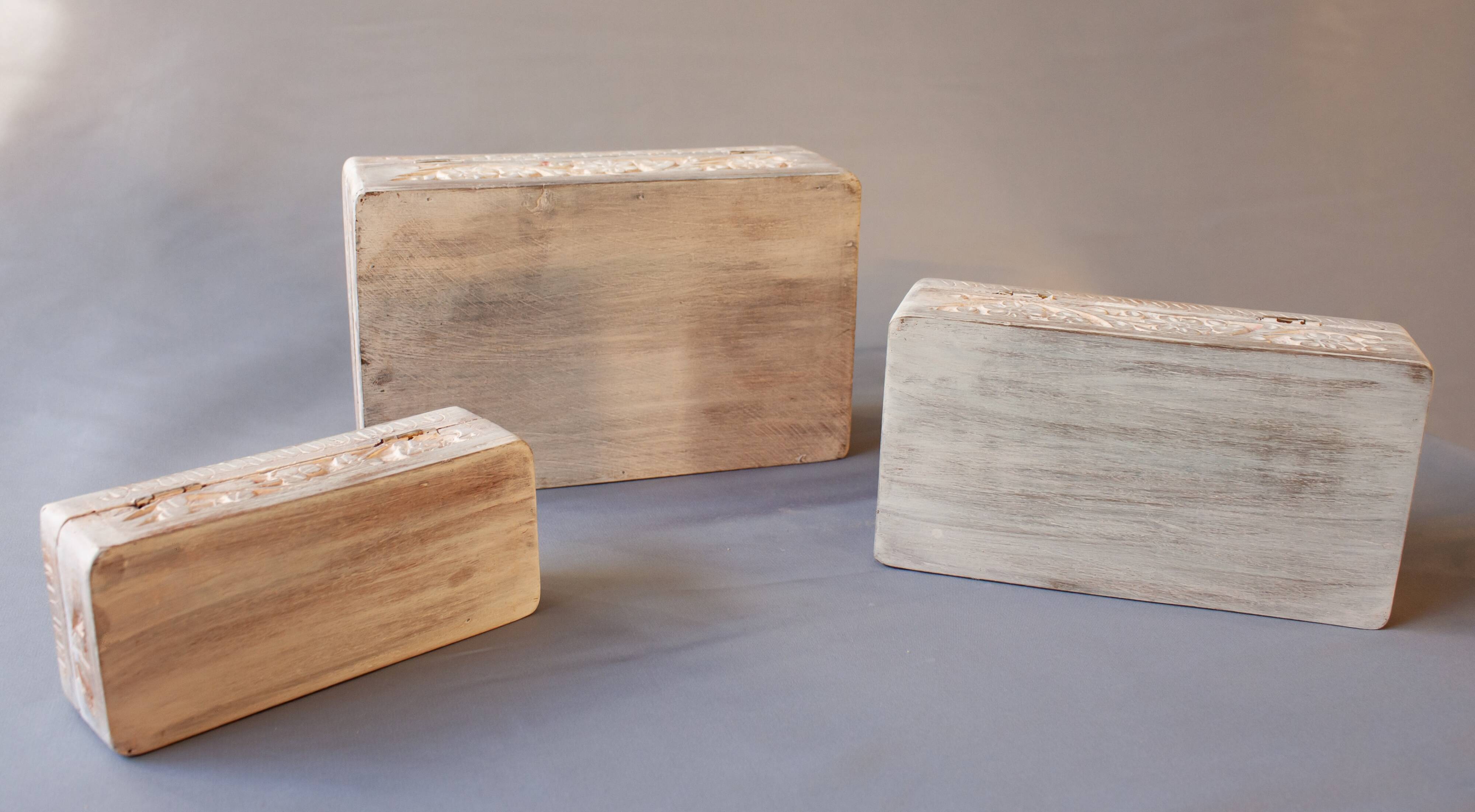 Hand-carved wooden boxes with ivory inlays
