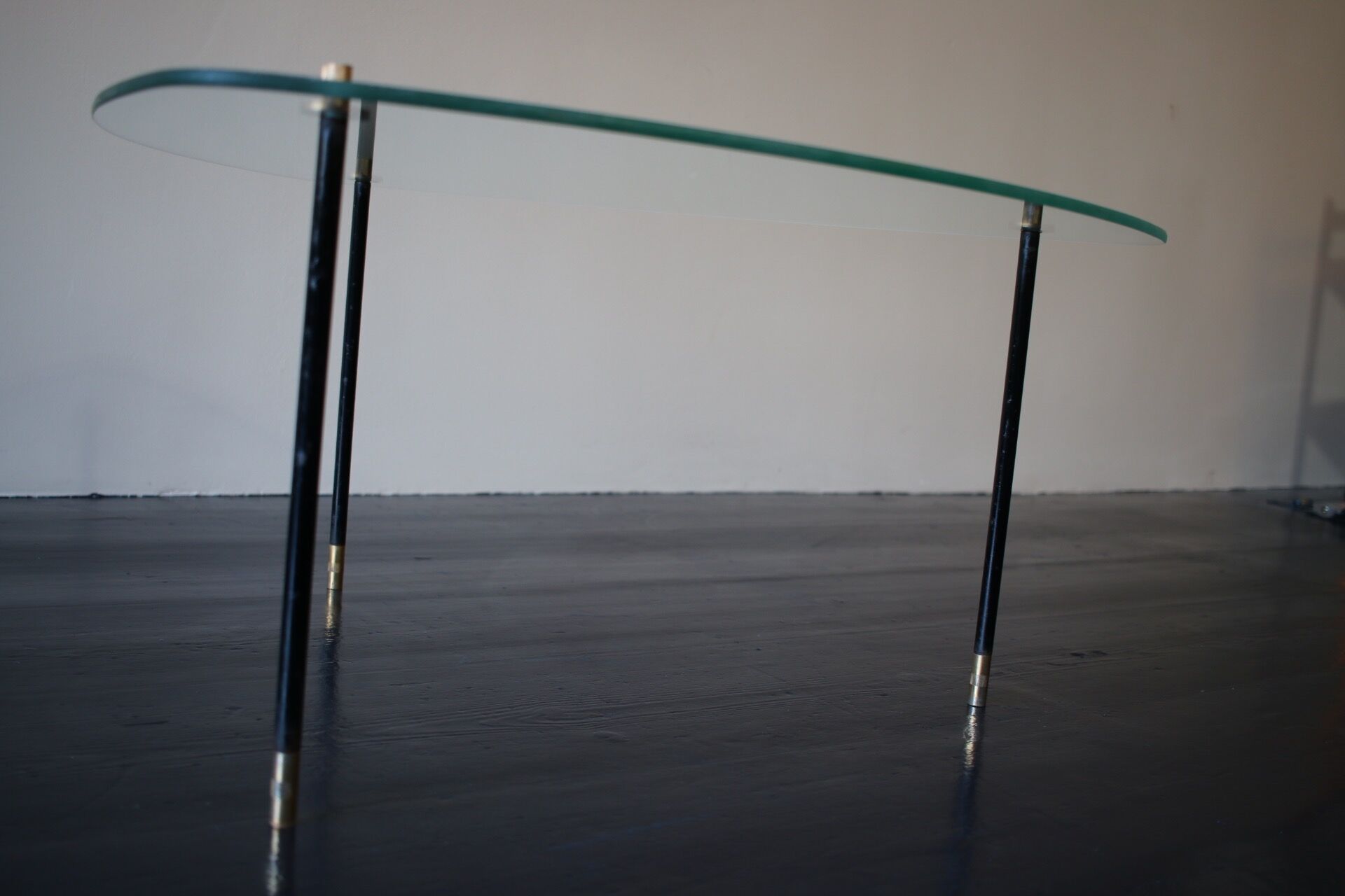 Vintage glass and black-painted brass side table