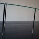 Vintage glass and black-painted brass side table