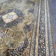 Large Persian wool rug 250x350 cm in gold and navy blue.