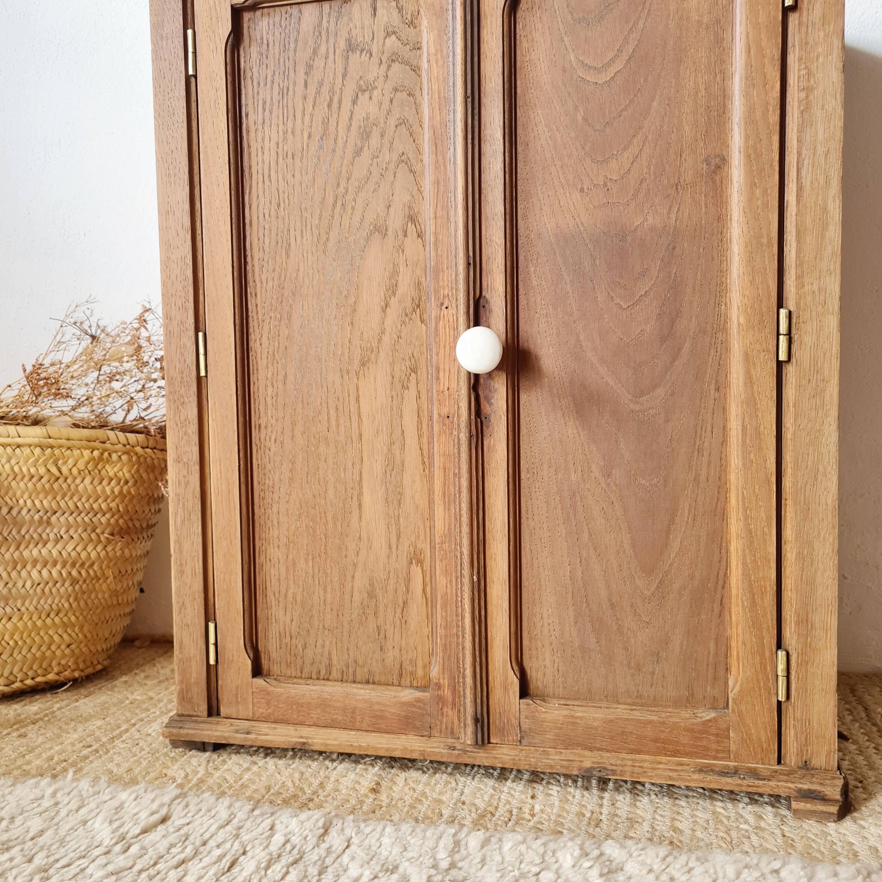 Small Parisian oak wardrobe with its porcelain knob.