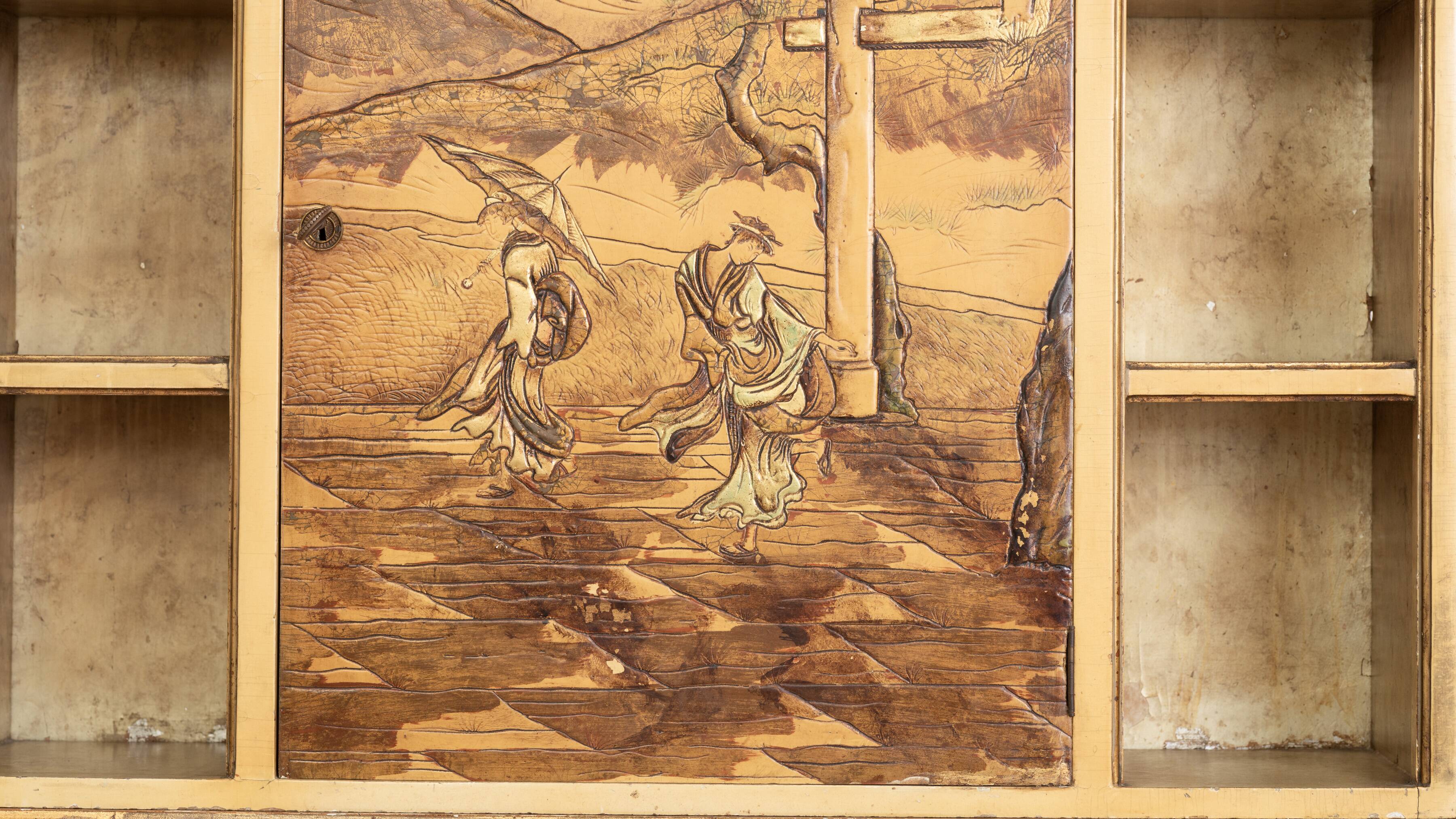 Desk with oriental motifs in relief