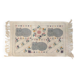 1980s handwoven cotton rug with a cat and flower pattern