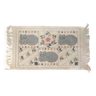 1980s handwoven cotton rug with a cat and flower pattern