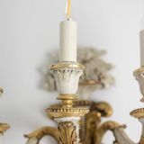 Pair of Louis XVI style wall lights in gilded and lacquered wood. Circa 1900.