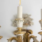 Pair of Louis XVI style wall lights in gilded and lacquered wood. Circa 1900.