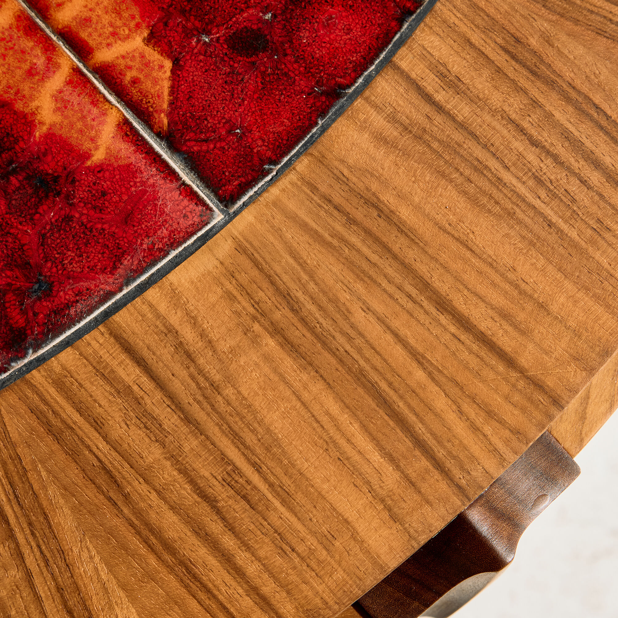 Coffee table in walnut with a ceramic top.