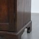 Charming and timeless antique English oak cabinet/commode from the early 19th century with two doors and a working lock