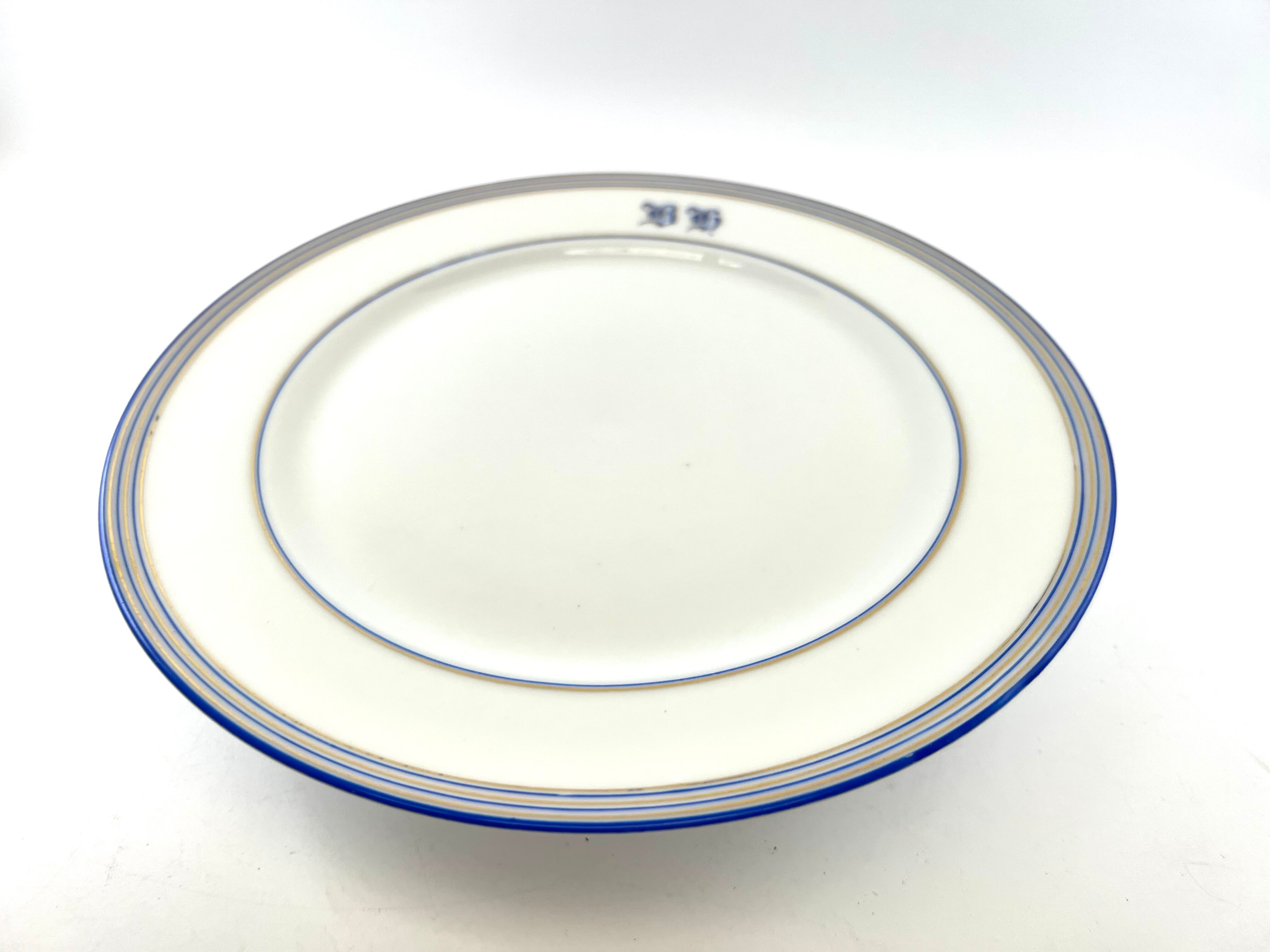 Compotier or flat cut with monogrammed white biscuit cake