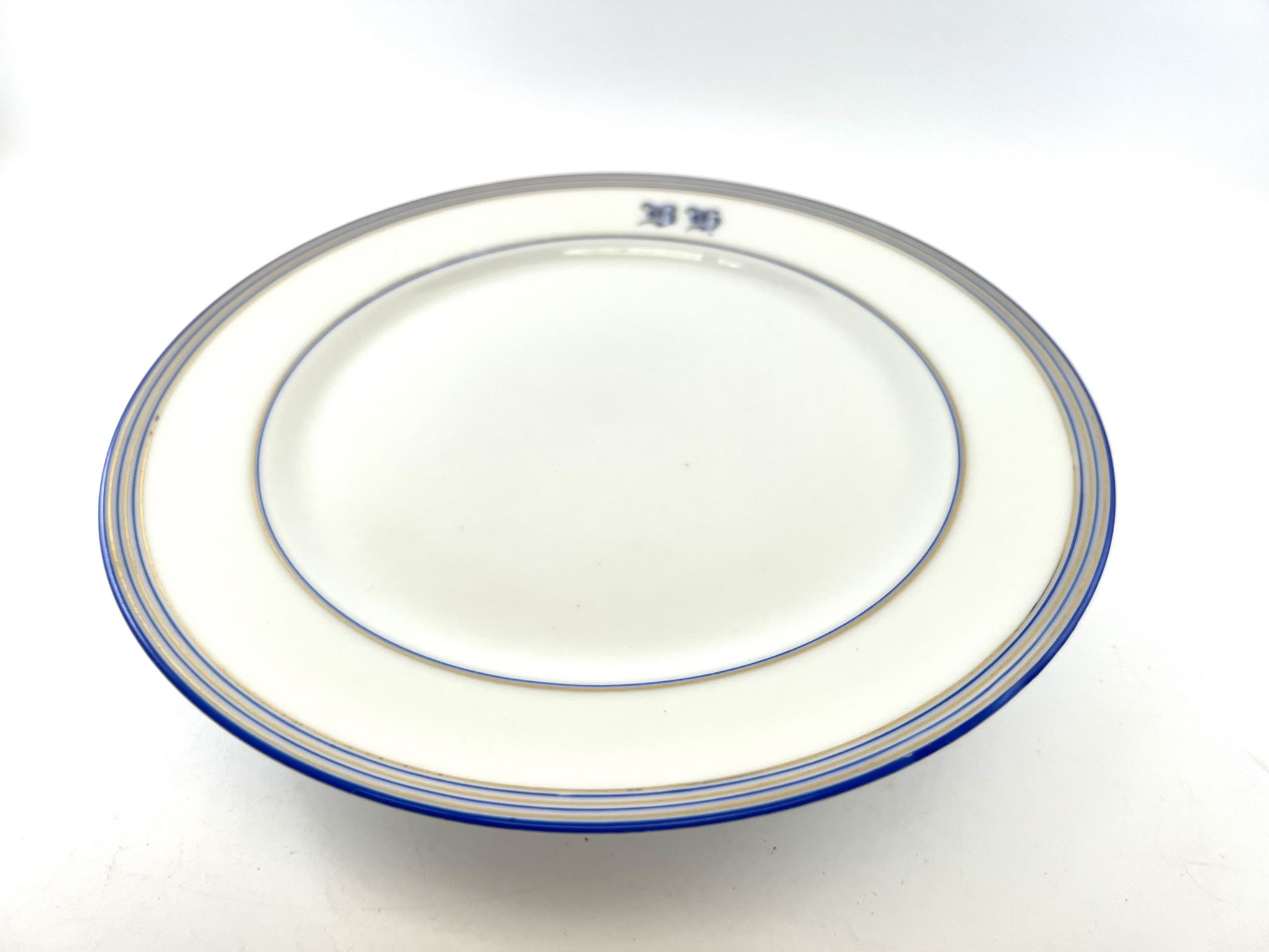 Compotier or flat cut with monogrammed white biscuit cake
