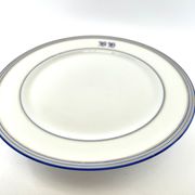 Compotier or flat cut with monogrammed white biscuit cake