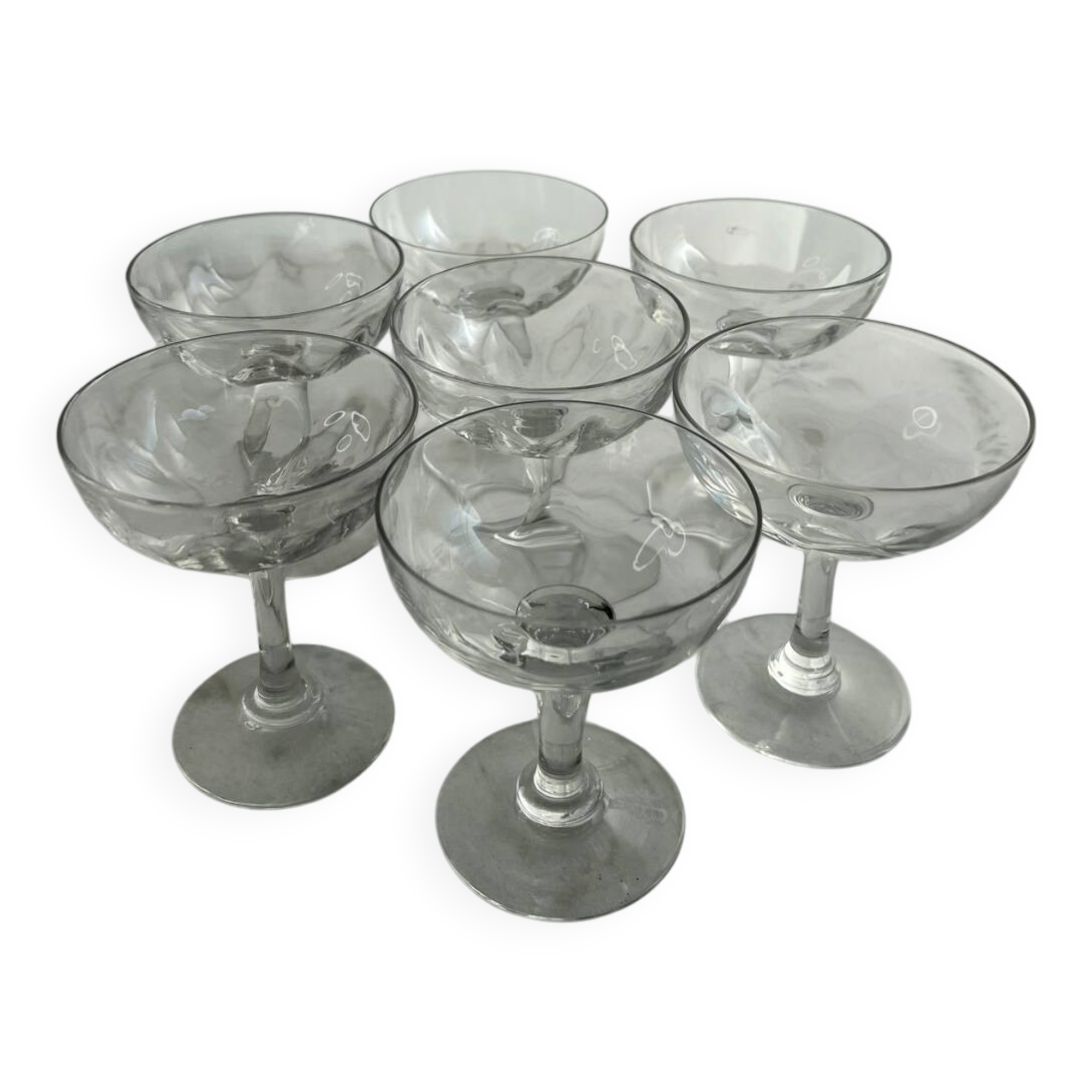Set of seven blown glass stemmed glasses.