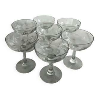 Set of seven blown glass stemmed glasses.