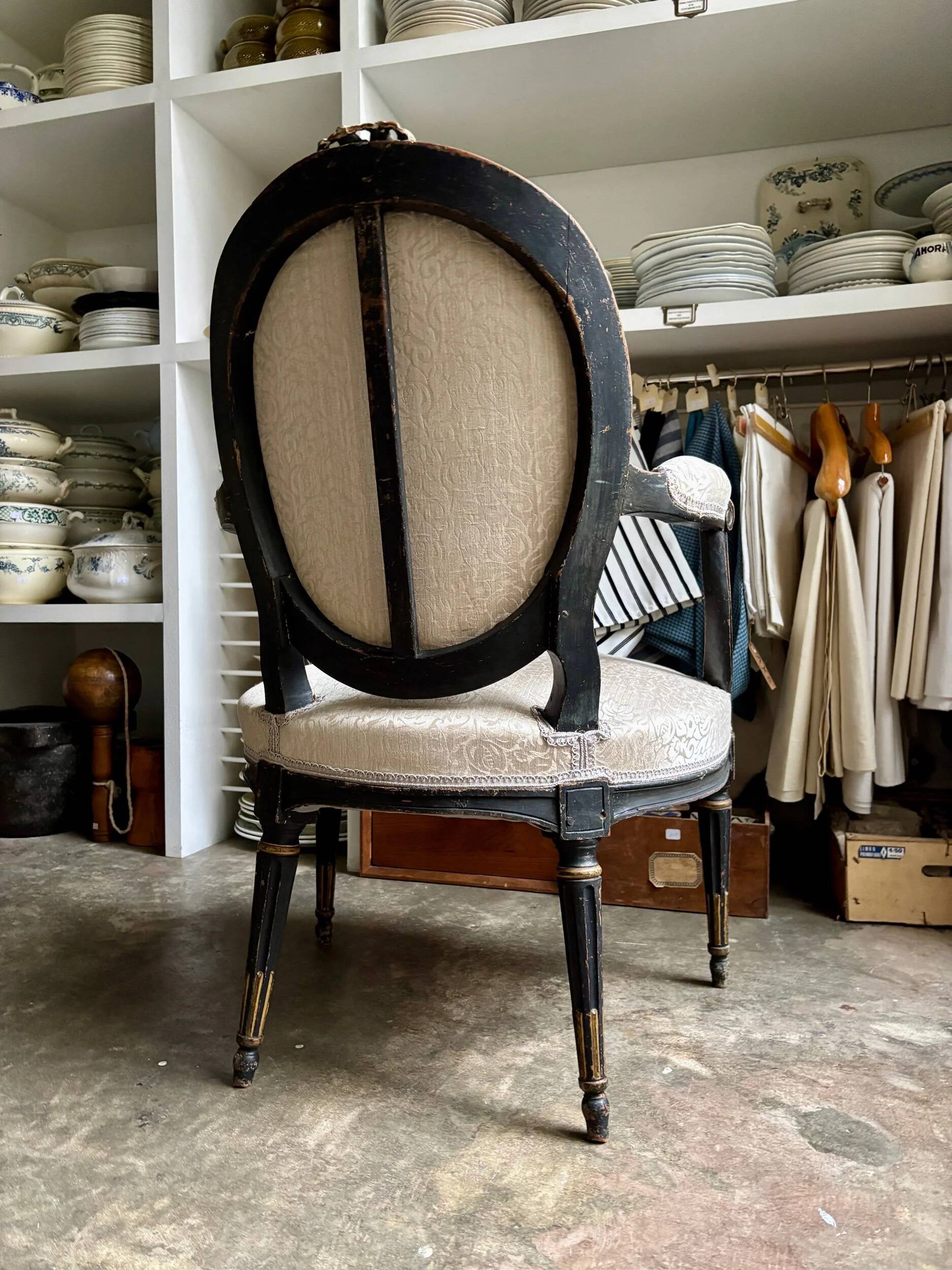 Cabriolet armchair with medallion back, Louis XVI period