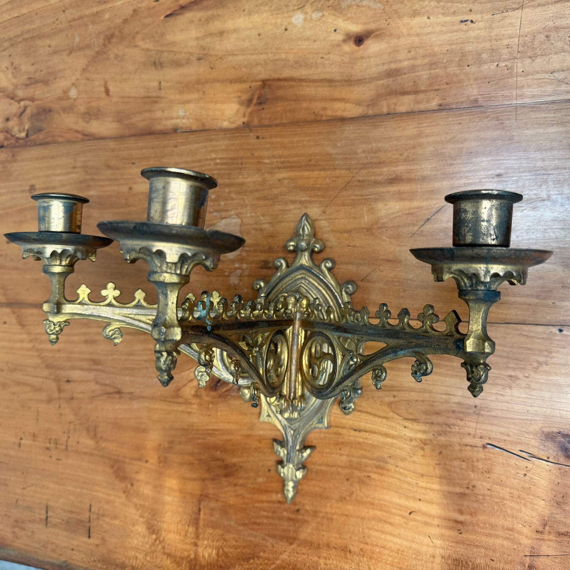 Elegant pair of three-light wall sconces from the 19th century.