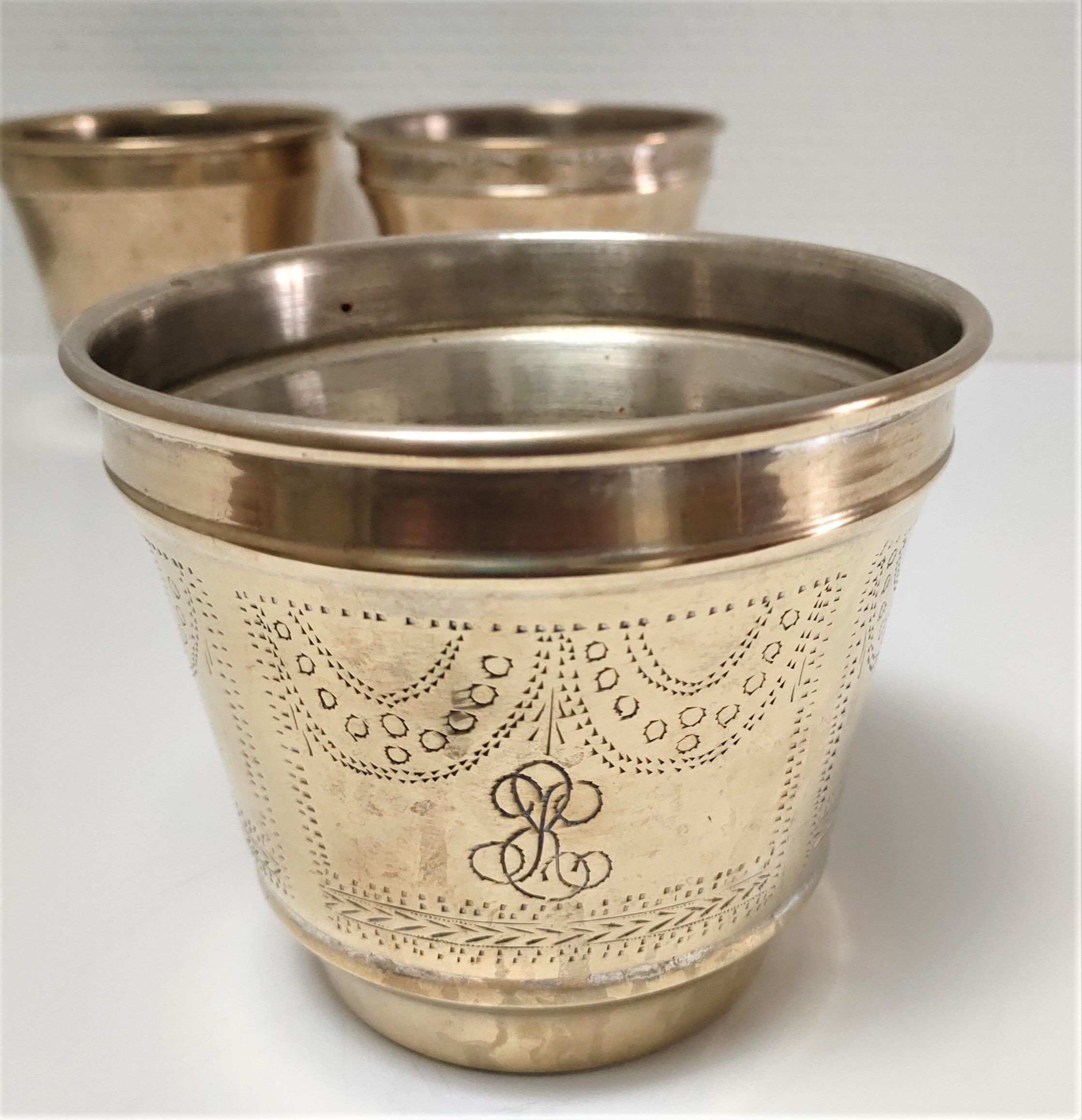 Three pot covers brass silver cover golden patina monogram early twentieth century