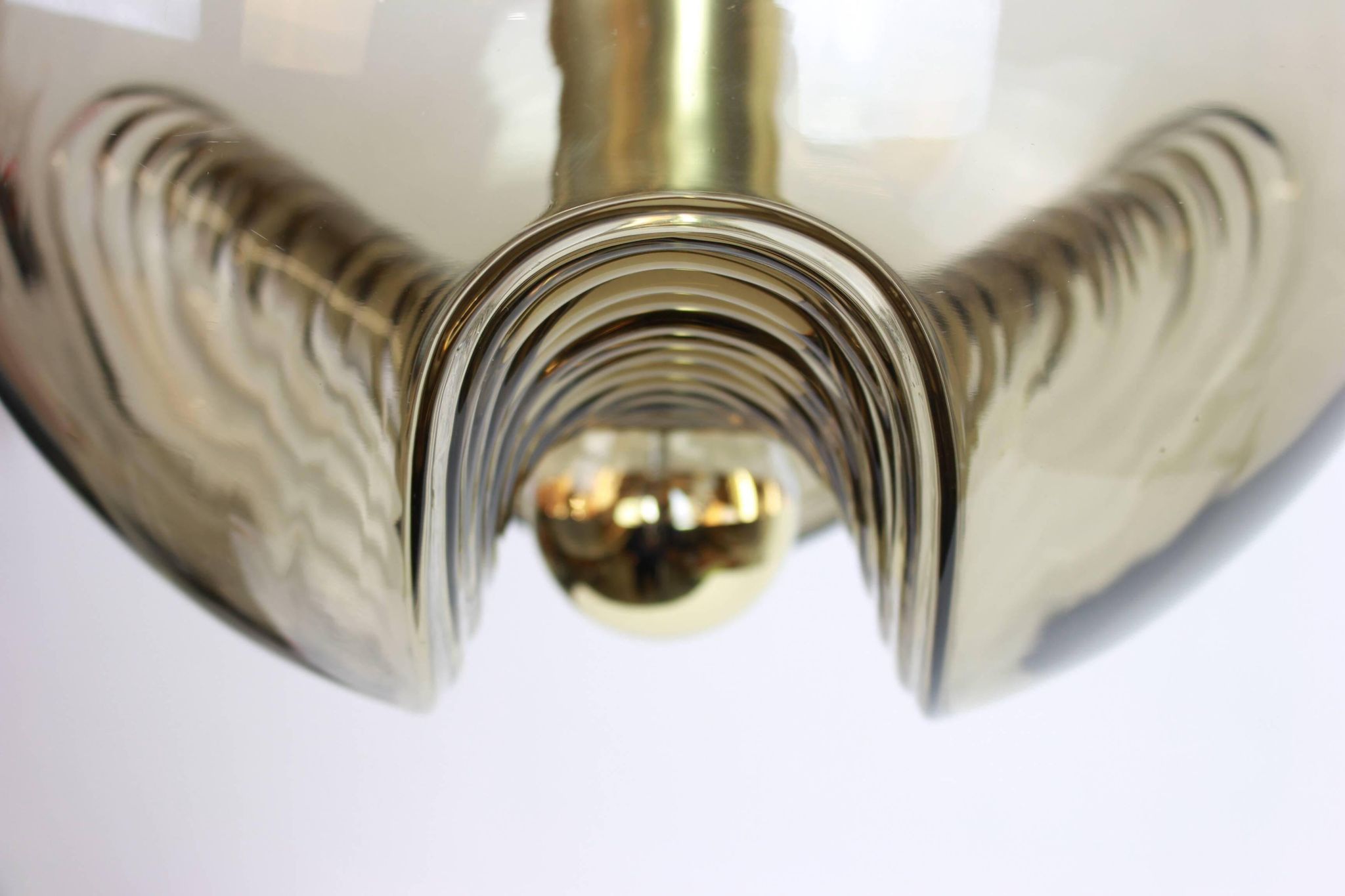 One of the four large smoked glass pendants by Peill & Putzler, Germany, 1970s.